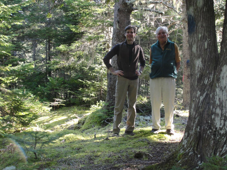 Moorehead (Mike) Kennedy (on right) tours Sanctuary Director, David Lamon through the land he donated to the Sanctuary. 