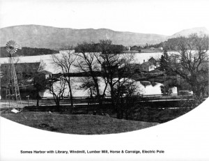 Somes Harbor with library, windmill, lumber mill, horse & carriage and electric pole.