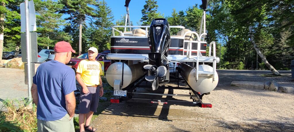 Courtesy Boat Inspector Alan Parks talking with a boater, August 31st, 2021